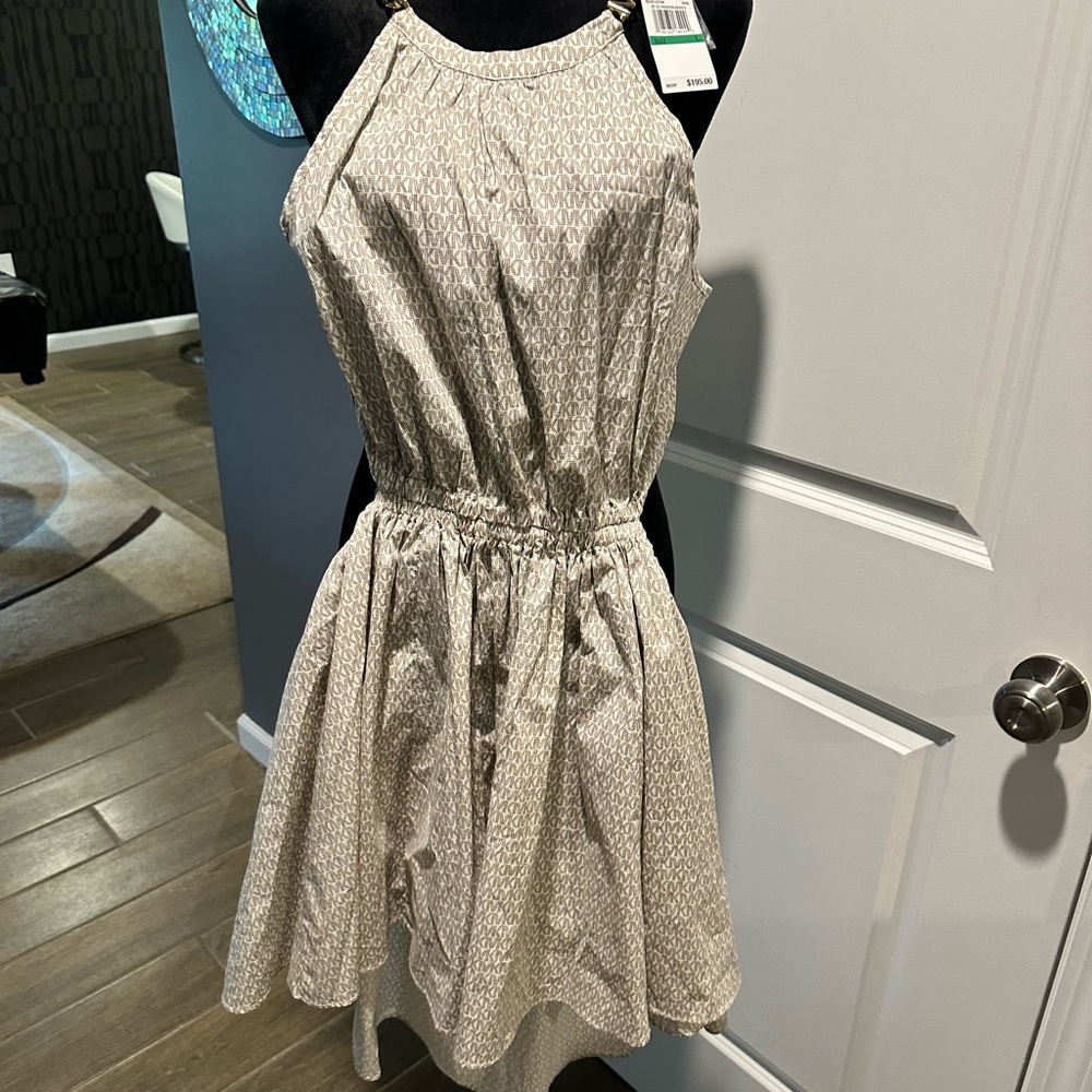 MK back out dress with gold link strap